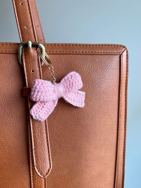 Indulge your romantic side with these charming accessories, ideal for adorning your keys and bags with a whimsical addition. Whether you're strolling through a quaint village or sipping tea in a sun-dappled garden, our Crochet Bow Keychain is the perfect companion for your adventures. Cottagecore Crochet, Bow Keychain, Crochet Accessory, Dappled Sunlight, Crochet Bow, Crochet Pink, Sipping Tea, Free Crochet Bag, Crochet Bows