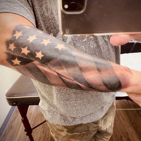 Patriotic Arm Sleeve Tattoos, Usa Forearm Tattoo, Patriot Sleeve Tattoo, Mens Flag Tattoo Ideas, Faded American Flag Tattoo, Forearm Flag Tattoo Men, American Flag Tattoos For Guys Forearm, America Sleeve Tattoo, American Flag Leg Tattoo