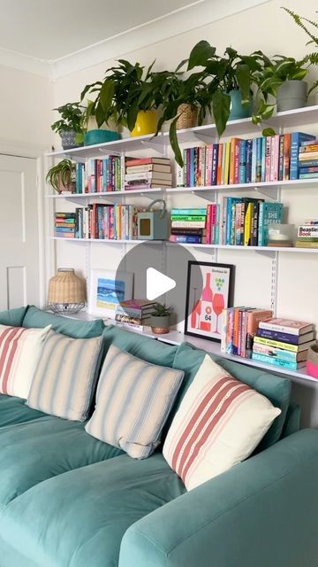 Emma on Instagram: "A little Saturday revamp for this room. As you know it’s taken ages to paint this room as I ran out of paint halfway through. Anyway I’m sort of glad I did as it gave me time to decide what to do with this wall before I pushed the couch back. I always need more book storage so shelves are perfect, plus I can move these around on the tracks if I want a change up. I honestly couldn’t face planning another gallery wall. Have a lovely Sunday ☀️ . . #myspaceanddecor #shelvesofinstagram #shelfiesunday #shelfielove #bookstack #myhousethroughalens #interiorrebellion #myhouseandhome #myhousemadehome #myhousethismonth #myinteriorvibe #myinteriorsquares #myinspiringinterior" Track Shelving Behind Couch, Bookshelf Over Couch, Bookshelves Over Couch, Shelving Behind Couch, Bookshelves Behind Couch, Bookshelf Behind Couch, Shelves Behind Couch, Track Shelving, Built In Shelves Living Room