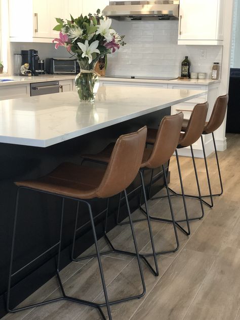 Slope leather counter stools in saddle from West Elm. West Elm Slope Counter Stool, Kitchen Counter Chairs, Brown Leather Bar Stools, Brown Dining Table, Brown Leather Chairs, Basement Furniture, Leather Kitchen, Black Kitchen Island, Kitchen Counter Stools