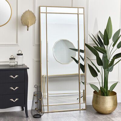 https://mirrorselect.com/          This Large Gold Framed Art Deco Wall / Leaner Mirror is a striking full length mirror, perfect for lovers of gold decor and metallic finishes. Made of wood, metal and glass, this mirror has a large rectangular shape and comes with an antique gold cross over metal frame and bevelled glass.    A lovely mirror choice for placement in a bedroom, hallway, living room or bathroom space. This mirror could easily blend into vintage, art deco or contemporary style… Large Art Deco Wall Mirror, Gold Frame Mirror Bedrooms, Large Mirror In Hallway, Master Room Decor Ideas Modern, Large Gold Mirror Living Room, Large Mirror In Dining Room, Long Gold Mirror, Mirror At End Of Hallway, Floor Length Mirror Bedroom