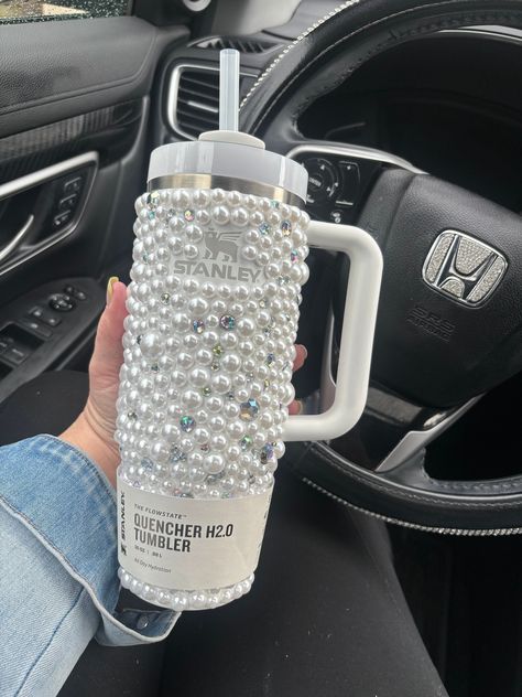 DESCRIPTION: This is for the purchase of 1, 40oz, 30oz or 20oz  Stanley quencher with hand laid rhinestones and pearls as shown. Please note that the logo on this cup is not covered in crystals. If you would like your cup to have the logo covered in crystals it is an extra charge. Please contact us with your color preference for the logo and for a quote to have the logo covered.  BASE CUP: Example photo is shown with a 30oz cup. Please note that the 20oz option does not come with a handle. We of Stanley Cup Decorations, 30oz Stanley Cup, Decorated Stanley Cup, Bling Stanley Cup, Decorated Stanley, Bedazzled Stanley Cup, Rhinestone Stanley Cup, Bedazzled Stuff, Custom Rhinestone