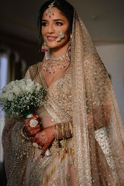 gold bridal lehenga ideas for 2022 brides Gold Bridal Lehenga With Red Dupatta, Indian Bridal Lehenga Gold, Best Indian Bridal Look, Gold Bridal Lengha With Red Dupatta, Gold Lehenga With Red Dupatta, Champagne Lengha Bridal, Bridal Sari Pink, Champagne Wedding Lehenga, Pink And Gold Wedding Lengha