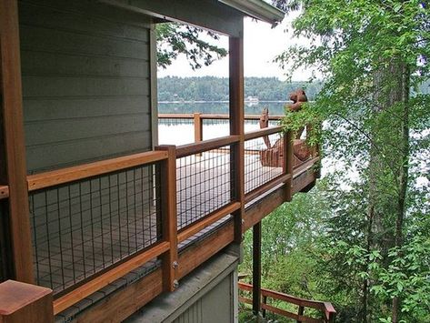 When the time comes I'd love to redo the deck railing with wire mesh.: Upper Deck Railing, Black Hog Wire Deck Railing, Rod Railing, Porch Railing Ideas, Wire Railing, Wire Deck Railing, Black Paneling, Cabin Deck, Deck Railing Ideas