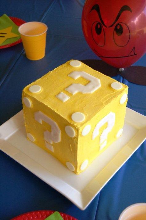 Super Mario Item Block cake Looks like something I could try for Matthew's 3rd Birthday. Super Mario Cake And Cupcakes, Super Mario Gender Reveal Party, Super Mario Cupcakes Birthday Ideas, Mario Wonder Cake, Diy Mario Cake Easy, Mario Party Birthday Cake, Mario Birthday Cake Ideas, Super Mario Bros Cake Ideas, Supermario Cakes