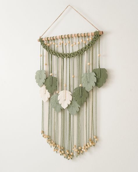 Decorate your walls with lush green leaves in this charming macrame art piece - a perfect gift idea for Mom, farmhouse enthusiasts, or those creating a safari-themed nursery. Enhance your living space with this intricate macrame wall hanging. 🎨🌿 🌟 Explore more at https://beandaikon.etsy.com/listing/1673232562 or get in touch with us directly! #homedecorinspirations #bohemianinspired #homedecorgifts #makrameart #bohogifts #handcraftedart #bohohomes #macrameofinstagram #wallhangingart #accen... Intricate Macrame, Safari Theme Nursery, Gift Idea For Mom, Themed Nursery, Boho Wall Hanging, Handcrafted Art, Macrame Art, Boho Gifts, Boho Designs