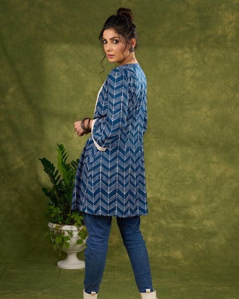 Elevate your wardrobe with our Boho Chic Indigo Blue Shrug. Featuring a vibrant print and whimsical laces, this piece will add a touch of bohemian flair to any outfit. Made with high quality materials, this shrug is both stylish and comfortable. Perfect for those looking for a unique and trendy piece to complete their look. #sujatra #sujatraglobal #sujatrajackets #bohochic #indigoblue #cottonshrugs #longshrug #cottonjacket #lace Blue Shrug, Long Shrug, Cotton Jacket, Indigo Blue, Boho Chic, Wardrobe, Lace, High Quality, Blue