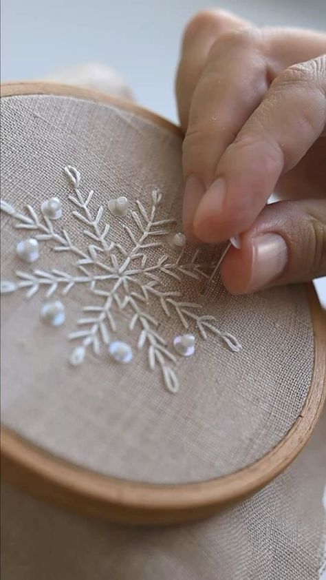 4.6K views · 16 reactions | I’m a big fan of the stab stitch - it’s simple and oh-so-pretty, perfect for giving your embroidery that extra special texture and a bit of sparkle with some sequins ✨ In our free online workshop for beginners, we’ll not only learn the basic stitches of embroidery but also have some fun playing around with beadwork. To reserve your spot in the stitch-along, click the link in the bio. If you can’t find it, simply comment «SNOWFLAKE» below, and I’ll send you the link Winter Embroidery Ideas, How To Embroider Snowflakes, Snowflake Embroidery Tutorial, Snowflake Embroidery Pattern Free, Embroidery Snowflake Patterns Simple, Simple Snowflake Embroidery Patterns Xmas, Embroider Snowflake Simple, Embroidered Hair Bows, Snowflake Embroidery