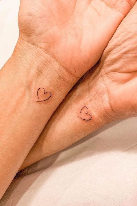 #CoolTattoos #TattooArt #InkMaster #TattooDesigns #InkedUp #TattooLovers #InkInspiration #TattooIdeas #CreativeInk #TattooStyle Maching Tattoos, Matching Friend Tattoos, Small Matching Tattoos, Tiny Heart Tattoos, Tiny Wrist Tattoos, Small Heart Tattoos, Small Pretty Tattoos, Writing Tattoos, Petite Tattoos