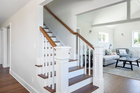 Stairway in First Floor Open-Concept & Remodel | Designed by Kirsten Dumo, Built by Model Remodel, Seattle, WA © Cindy Apple Photography Open Concept With Stairs In Middle Floor Plans, Open Concept Stairs In Middle, Open Floor Plan With Stairs In Middle, Center Staircase Open Floor Plan, Staircase Open On Both Sides, Closed In Staircase Ideas, Open Concept With Stairs In Middle, Open Stairs In Living Room, Open Staircase Ideas