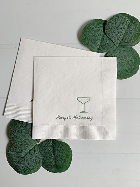 Introducing our "Margs and Matrimony" Bachelorette Cocktail Napkins, a delightful addition to your bridal celebrations. These charming napkins feature a crisp white background adorned with sage green foil, exuding a touch of elegance and sophistication. Perfect for bachelorette parties, bridal showers, and bridal brunches, they add a whimsical flair to your festivities. Margs And Matrimony Bridal Shower Ideas, Margs & Matrimony, Tini Party, Bachelorette Cocktails, Backyard Bridal Showers, White Bridal Shower, Bachelorette Party Planning, Wedding Shower Decorations, Bridal Bachelorette Party