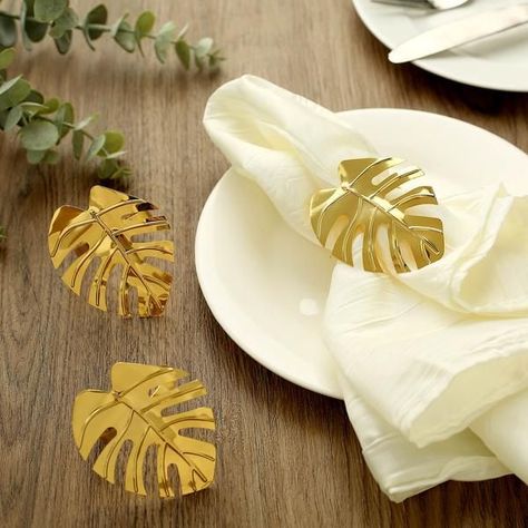 $8.99 | Impart tasteful tropical charm to your tablescape and place setting with our chic Metallic Tropical Leaf Design Napkin Rings. Combining the glimmering glitz of shiny metallic construction with the contemporary charm of tropical leaf design, these modish metallic napkin rings will take your tablescape to the heights of sophistication. The whimsical appeal of these rings makes them an ideal option for tropical theme events, Hawaiian-style events, beach weddings, birthdays and more! Tropical Leaf Decor, Banquet Decor, Gold Napkin Rings, Wooden Napkin Rings, Metal Napkin Rings, Gold Napkins, Napkin Holders, Foil Paper, Tropical Theme