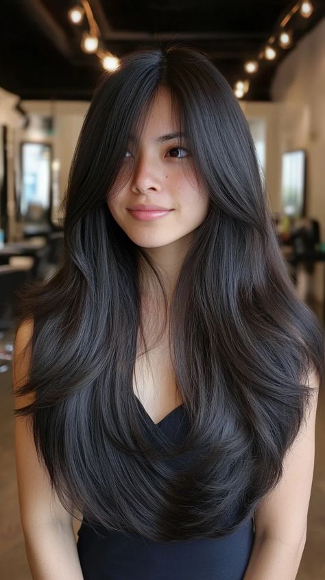 This hairstyle showcases beautifully voluminous layers that frame the face, creating a soft, romantic vibe. The long, flowing hair features subtle layers that add depth and movement, making it perfect for those who desire a glamorous appearance without excessive styling. To achieve this look, using a volumizing mousse before blow-drying can enhance lift at the roots. Consider employing a large round brush while drying to create sweeping waves. For added shine and manageability, apply a lightweig Long Voluminous Haircut, Blow Dry Long Hair, Long Rounded Layers Haircut, Soft Layers Long Hair, Voluminous Haircut, Long Voluminous Hair, Voluminous Layers, Dry Long Hair, Long Flowing Hair