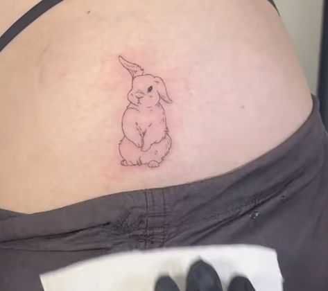 Bunny Hip Tattoo, Bunny Eating Strawberry Tattoo, Dainty Rabbit Tattoo, Bunny Holding Flower Tattoo, Red Bunny Tattoo, Red Rabbit Tattoo, Bunny Angel Tattoo, Realistic Bunny Tattoo, Small Bunny Tattoo Simple