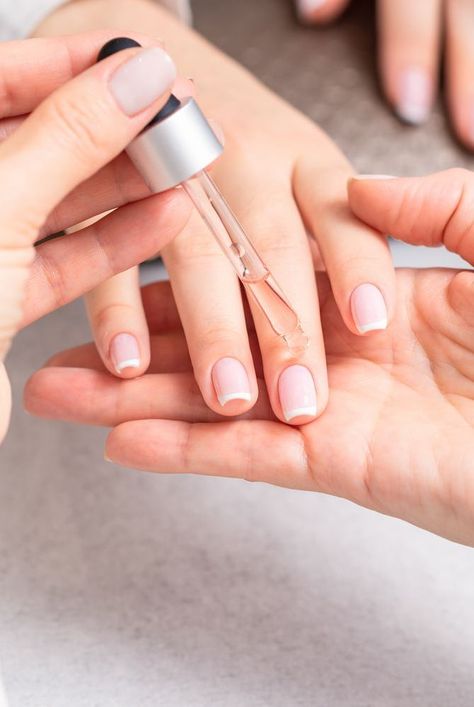 Nail experts explain what does cuticle oil do, the benefits of cuticle oil, how to use cuticle oil, and some of the best cuticle oils to try. #beautyhacks #beautytips #nails #cuticleoil Cuticle Oil Benefits, Best Cuticle Oil, Empty Nail Polish Bottles, Healthy Cuticles, Cute Pink Nails, Nail Polish Bottles, Nail Oil, Brittle Nails, Shiny Nails