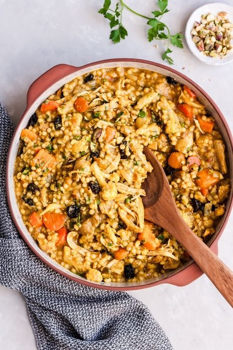 The most delicious Moroccan Chicken Stew with sweet potato, couscous and cauliflower. Simmered with cozy spices thanks to cinnamon, anti-inflammatory turmeric, and earthy cumin. Pistachios, dried cherries and parsley are stirred into this stew once done cooking for a unique twist. #moroccan #stew #chickendinner #healthyrecipe Moroccan Chicken And Couscous, Sweet Potato Couscous, Moroccan Cauliflower, Moroccan Chicken Stew, Mediterranean Sweet Potatoes, Moroccan Stew, Chicken Couscous, Moroccan Couscous, Chicken Chickpea