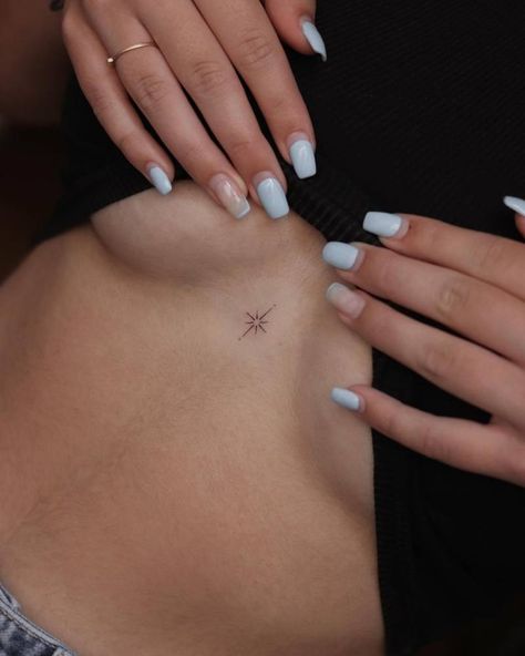 Minimalistic style north star tattoo done on the Sparkle Tattoo On Chest, North Star Back Tattoo, North Star Tattoo Behind Ear, Small North Star Tattoos, Spine Star Tattoo, Sternum Small Tattoo, Lower Chest Tattoos For Women, Dainty Stars Tattoo, High Chest Tattoo