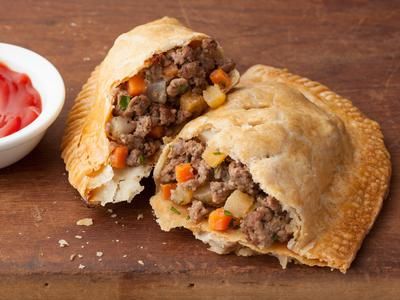 Meat Pie Recipes from Across the Country | Devour The Blog: Cooking Channel's Recipe and Food Blog Meat Hand Pie Recipe, Pasties Recipes, Hand Pie Recipes, Hand Pie, State Foods, Meat Pie, Hand Pies, Cooking Channel, Beef Dishes