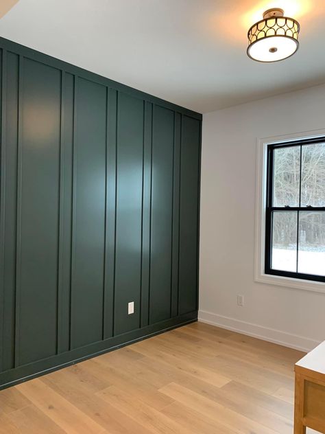 Board And Batten Upper Half Wall, Board And Batten Dark Wall, Office Room Wall Paneling, Vertical Moulding Accent Wall, Dark Green Batten Board, Office Accent Wall With Window, Media Room Accent Wall, Wood Trim Wall Design, Dark Blue Board And Batten Wall