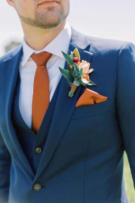 Dusty Blue And Rust Bridesmaid Dresses, Blues And Orange Wedding, Navy Blue Suit Orange Tie, Navy Blue Suit Rust Tie, November Wedding Groom Attire, Blue Suit With Terracotta Tie, Blue Suit With Orange Tie, Blue Suit Terracotta Tie, Navy Blue And Burnt Orange Wedding Suit