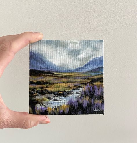 Mini landscape painting - this was measures 10x10cm (4x4inch) and marks the fourth small landscape that I have painted , available through my Etsy shop. I hope you can feel the cold moist damp air and smell the wild untamed ancient land in this little painting … I hope it draws you closer 🙂 #miniature #landscapepainting #mountain #smallart #etsyseller #mountainlandscape #irelandtravel #irelandcalling #irishart #tinyart #gifts #affordableart #naturelovers #mountainviews #landscapelovers #lan... Landscape Mini Paintings, Tiny Square Paintings, Watercolor Mini Landscapes, Mini Forest Painting, Tiny Mountain Painting, Winter Lake, Lake Painting, Irish Art, Small Canvas Art