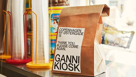 GANNI's Hits Our Sweet Spot with Upcycled Merch Made by Female Creatives | TheArtGorgeous Ganni Packaging, Pop Up Kiosk, Ganni Branding, Burger Packaging, Cafe Branding, Danish Fashion, Copenhagen Fashion, Brand Creation, Copenhagen Style