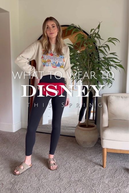 Here I'm sharing some ideas on what to wear to Disneyland if you're going this spring. We went recently and I picked out this comfortable outfit which was perfect! I paired this Disney themed sweatshirt (I linked a bunch of similar ones on my LTK page) with these leggings, Birkenstock sandals, and this belt bag! Let me know what you think! | Disney, mom life, motherhood, day trips, activities, theme parks, comfort, outfits, style, inspiration Athletic Theme Park Outfits, Mom Park Outfit Spring, Mom Theme Park Outfit, Disneyland Outfits Women Spring, Comfortable Theme Park Outfit, Mom Disney Outfit Spring, Spring Disneyland Outfits, Disney Leggings Outfit, Leggings Disney Outfit