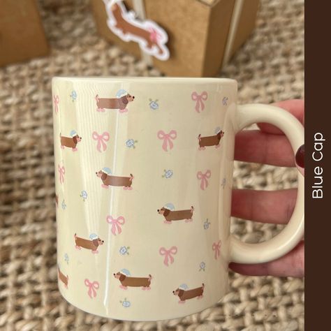 Sipping just got sassier 🐾💐! Introducing the must-have mug for every dog lover - our Floral Sausage Dog Ceramic Mug. #smallbusiness #smallbusinessowneruk #lilpinsessentials #SipInStyle #DogDecor #FloralDesign #ChicSips #HomeTrends #PetLovers #StylishHome #UniqueMugs #DecorInspiration #AnimalMagic Breakfast Mug, Dachshund Pattern, Dog Ceramic, Pattern Ceramic, Animal Magic, Dachshund Gifts, Mug With Handle, Oatmeal Breakfast, Cute Kitchen