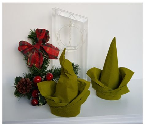 These are easy to fold and you can be a little creative about the end result.  Lovely for Christmas but might even work for Halloween if you form that out of black napkins. Elf Hat Napkin Folding, Halloween Napkins Folding, Halloween Napkin Folding Ideas, Halloween Napkin Folding, Diy Napkin Folding, Christmas Elf Hat, Napkin Folding Tutorial, Napkin Art, Paper Serviettes