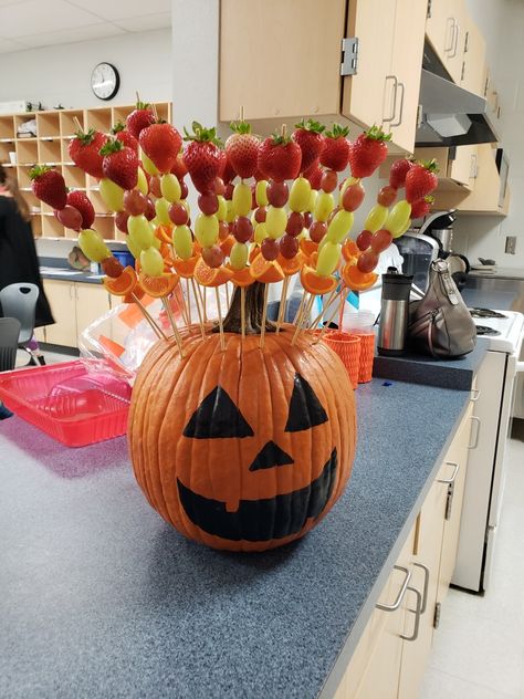 This was simple to make, and the face was made using a black paint pen. It was a hit! Pumpkin Painting Party Snacks, Scary Pumpkin Carving Toothpicks, Pumpkin Themed Snacks For Kids, Halloween Puking Pumpkin Dip, Jack O Lantern Fruit Cups, Christmas Song Trivia, Pumpkin Painting Party, Fruit Sticks, Pumpkin Party