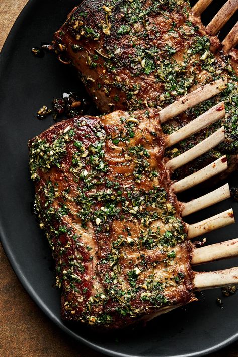 A rack of lamb is an elegant, yet easy to prepare meal. Lamb is first seared in a hot skillet and then finished in the oven with an herb oil. Serve with a bright mint sauce and veggies. Rack Of Lamb With Mint Sauce, Roast Lamb Rack Recipes, Lamp Rack Recipe, Roast Rack Of Lamb Recipes, Recipe Lamb Chops, Rack Lamb Chop Recipes Baked In Oven, How To Cook Rack Of Lamb, Lamb Rack Photography, Greek Rack Of Lamb