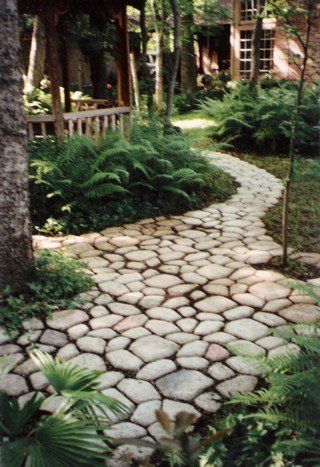 QUIKRETE COBBLESTONE PATH MOLD.  Mix with sea glass; beautiful.  This would so cut down on the amount of mud trekked into the house. Rock Pathways, Walkway Pavers, Cobblestone Path, Garden Pathways, Walkways Paths, Garden Walkway, Stone Path, Seaside Cottage, Garden Pathway