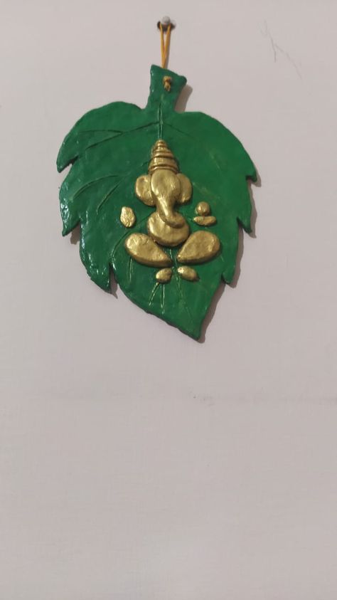 Ganesha on leaf# made with clay Dipawali Decoration, Diy Ganesha, Ceramic Mural, Ganesha Murti, Clay Ganesha, Recycled Paper Crafts, Diy Fabric Jewellery, Mirror Crafts, Ganesh Art