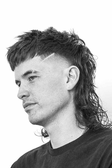 The mullet, a hairstyle that first gained prominence in the 1980s, is making a bold comeback. This iconic 'business in the front, party in the back' look has evolved over the years, adapting to modern trends while staying true to its rebellious roots. Today, the mullet is more versatile than ever, offering a variety of styles that suit different tastes and personalities. Here are 21 of the best mullet hairstyles for men, each offering a fresh take on this retro classic. 1. The Classic Mullet - Layered Mullet Men, Long Mullet Men, Modern Mullet Men, Modern Mullet Mens, Mullet Hairstyle Mens, Viking Hairstyles Male, Classic Mullet, Haircuts Male, Mens Long Hair