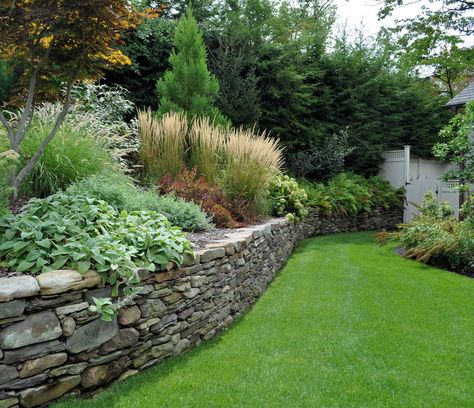 Dry laid Pennsylvania field stone wall. Field Stone Wall, Natural Stone Retaining Wall, Stone Walls Garden, Elegant Landscape, Landscaping Around House, Garden Retaining Wall, Sloped Backyard, Landscaping Retaining Walls, Natural Stone Wall