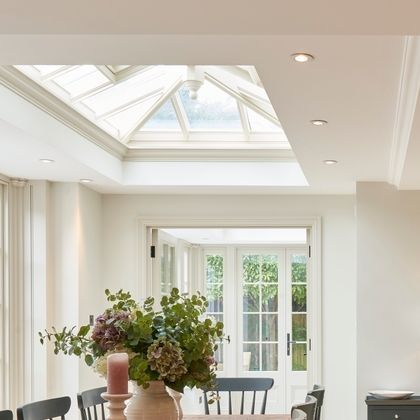 Claire Garner Interiors on Instagram: "One of my favourite things about this design is the juxtaposition between the long table and beautiful skylight... When designing a space, it's so important for me to understand my client and how they enjoy using their space. For this one, we knew they love to entertain and needed a large dining table... so we wanted to create an area which felt separate within an open plan area. We had seen this beautiful skylight was going to be added in from the architects drawings - so we mirrored this with a long narrow dining table to create that feeling of a room within a room. xxx   #interiordesign #interiorinspiration #interiorstyling #homeinspiration #clairegarnerinteriors #interiors #homecounties #designtips #interiordesigntips" Skylight In Dining Room, Skylight Over Dining Table, Dining Room Skylight Ceilings, Sky Lights In Kitchen Roof Window, Long Narrow Dining Table, Narrow Dining Table, Room Within A Room, Large Skylight, Narrow Dining Tables