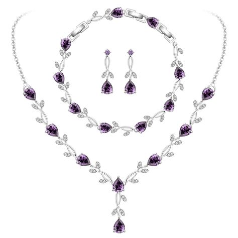 PRICES MAY VARY. ❤ROMANTIC WEDDING JEWELRY❤: This elegant and classic purple jewelry set is the best accessory for bride and bridesmaids, it fits perfectly with wedding dress and flowers and will make your wedding more romantic. Wearing it is like decorating yourself and your bridesmaid with a series of purple wreaths.Your bridesmaids will share your happiness with it. ❤UNIQUE PURPLE ROSE JEWELRY SET❤:The designer used a series of amethysts and cubic zirconia to create this sparkling purple rose Purple Bridal Jewelry Sets, Elegant Purple Necklace For Wedding, Elegant Purple Bridal Necklace For Wedding, Purple Crystal Jewelry Sets For Wedding, Purple Rhinestone Wedding Necklace, Purple Wreaths, Purple Jewelry Set, Amethyst Jewelry Set, Mother Of The Bride Jewelry