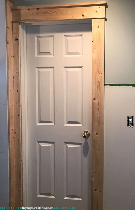 Board and batten is one of the cheapest and easiest ways to makeover a room. With just a few materials and tools even a novice DIY'er can transform a room over a weekend. Door Frame Upgrade, Board And Batten Door Trim, Door Facings Ideas, Board And Batten With Wood Trim, Door Frame Makeover, Trim Boards Ideas, Cheap Trim Ideas, Cheap Baseboard Ideas, Diy Door Frame