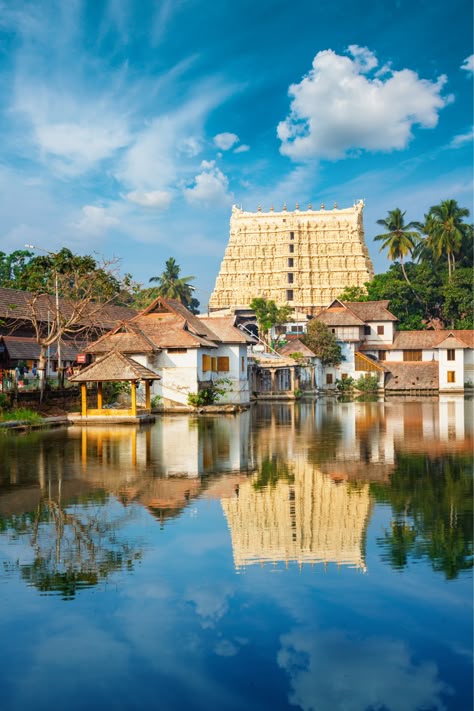 At the Sree Padmanabhaswamy Temple, visitors can witness the grand architecture that blends Kerala and Dravidian styles, with the iconic 7-storey gopuram towering above. The temple’s sanctum holds the reclining Vishnu deity, viewed through three distinct doors, each offering a different perspective. The temple's intricate stone carvings, murals, and sacred mandapams enrich the experience. Visitors also explore the mystery of the unopened vaults, said to contain unimaginable treasures. Anantha Padmanabha Swamy, Sree Padmanabhaswamy Temple, Padmanabhaswamy Temple, Spiritual Heart, Manifesting Vision Board, Shiva Wallpaper, Ben Affleck, 2025 Vision, Vaulting