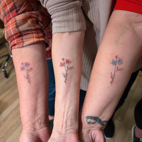 :: Three Sisters :: "We three sisters don't hardly ever get together, because one of us lives in Arizona and the other two in Ohio. So while we were recently all together for a week, we decided to do something lasting and meaningful, sister tattoos. All the same design just different colored flowers, our birthstone colors. We stand together as one, but yet different." Written in my Client's own words. Tattooer: Arminda #storylineinktattoo #tattoosbyminda #realtattoo #nofilter Sister Birth Flower Tattoo, Sisters Tattoo For 3, Matching Sibling Tattoos For 3, 4 Sibling Tattoos, Twin Tattoos Sisters, Three Sibling Tattoos, 3 Person Tattoo, Meaningful Sister Tattoos, Three Sister Tattoos