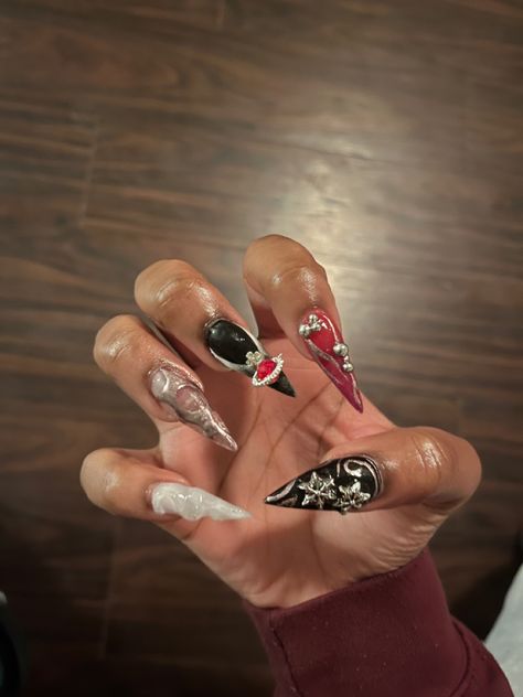 Black red silver and white stiletto nails with 3D designs Red Stilletos Nails, Red And Black Stiletto Nails, Almomd Nails, Red Stiletto Nails, Black Stiletto Nails, Red Gel Nails, Y2k Nails, Long Acrylic, Metallic Nails