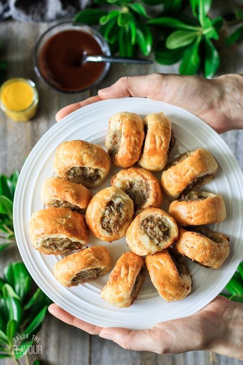 British Sage and Fennel Sausage Rolls: buttery rough puff pastry and a simple pork sausage filling make this traditional British food a delicious appetizer. Serve them warm or cold at a party with HP sauce or mustard—they’ll disappear quickly! | www.savortheflavour.com #sausagerolls #sausage #puffpastry #britishfood #appetizer British Christmas Food, British Sausage Rolls, Appetizers Puff Pastry, British Sausage, British Picnic, British Snacks, British Food Traditional, Rough Puff, Sausage Appetizers