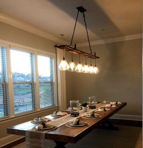 "Our 6 hanging pendant barnwood chandelier combines rustic warmth with industrial style. Fixture has 6 pendants each with a clear glass shade and hangs from a barn wood plank. Mounting plate is 5\" x 10\" thick steel. Fixture measures 72\" long by 7\" wide and 36\" from canopy to bottom of glass shades (can be adjusted by removing links from upper chain) . All electrical components are new. Includes black steel canopy and all mounting hardware. (bulbs ARE included). Funnel Lamp FREE SHIP Hanging Light Chandelier, Dining Room Lighting Chandeliers, Rustic Chandelier Lighting, Farmhouse Dining Room Lighting, Reclaimed Wood Beams, Wood Light Fixture, Farm Living, Kitchen Lights, Farmhouse Kitchens