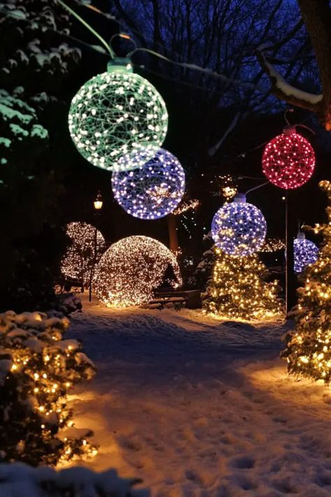 Transform your outdoor space with magical Christmas garden lights. From garden path lights to twinkling tree decorations, these ideas will bring holiday cheer to every corner of your yard. #OutdoorChristmas #GardenLighting #HolidayLightsOutdoor Outdoor Tree Ornaments Christmas, Outdoor Christmas Lights In Trees, Outdoor Christmas Pot Lights, Christmas Lawn Ideas, Long Driveway Christmas Lights, Decorate Outdoor Christmas Tree, Outdoor Xmas Decorations Lighting Ideas, Diy Christmas Pathway Lights, Outdoor Ornaments Yard Decorations