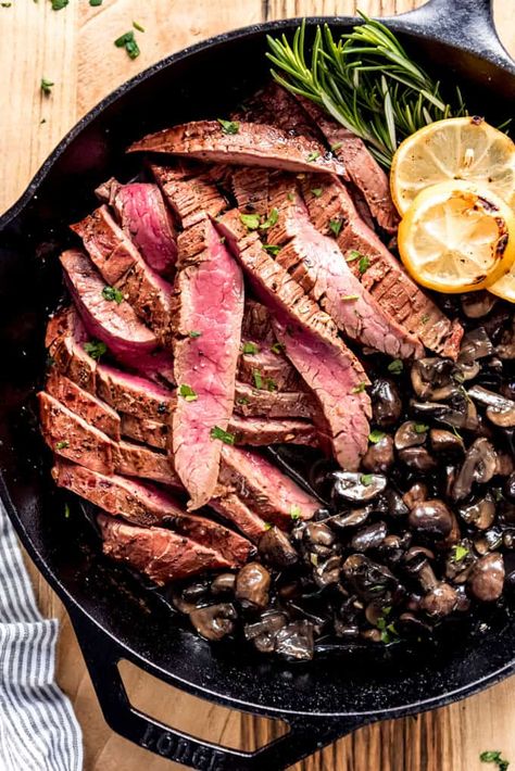 Grilled Flank Steak with Mushrooms is a delicious and flavorful recipe that you're going to love. With marinated beef, Baby Bella mushrooms, fresh herbs, and lemon, it's a savory, satisfying dinner that is perfect for a date night in or for a family dinner! #flanksteak #beef #meat #best #mushrooms #sauce #easy #grilled #grilling #steak Steak With Mushrooms, Mushrooms Sauce, Grilling Steak, Grilled Ribeye Steak, Grilled Turkey Burgers, Mushroom Recipes Healthy, Marinated Flank Steak, Grilled Flank Steak, Steak And Mushrooms