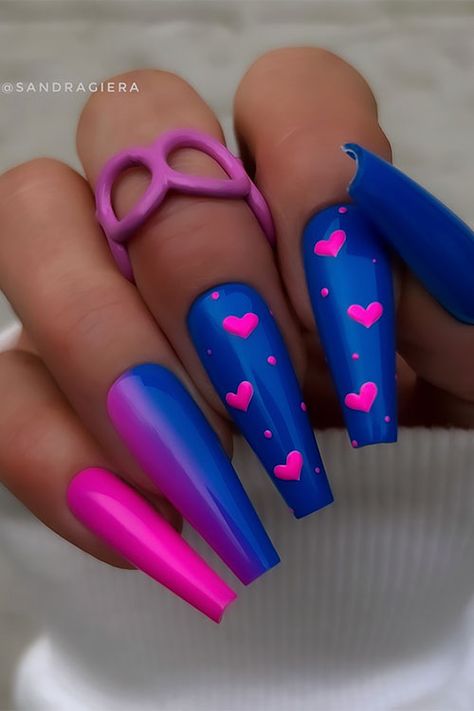 Long coffin-shaped royal blue Valentine's Day nails adorned with hot pink heart shapes on two accent royal blue nails Royal Blue And Pink Nails, Blue And Pink Nail Designs, Hot Blue Nails, Hot Pink And Blue Nails, Bright Nail Designs, Royal Blue Nails, Fun Summer Nails, Hot Pink Nails, Sassy Nails