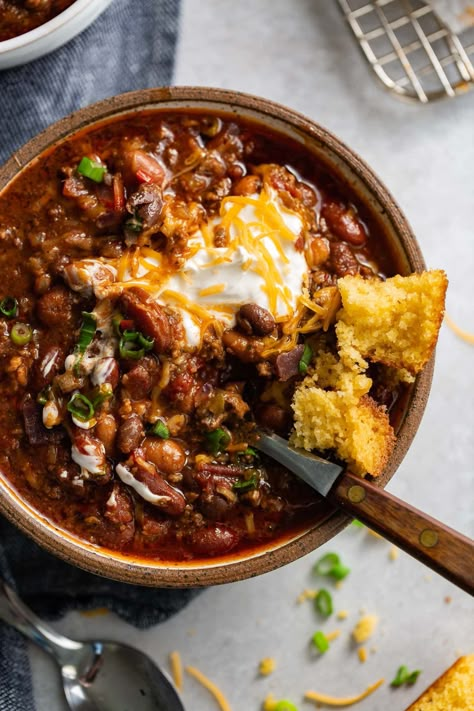 The best chili I have ever made! It's packed with ground beef, bacon and 3 kinds of beans with just the right combination of spices for the perfect flavor! Top it off with a little sour cream and shredded cheese, Yum! #recipe #chili #ground beef Chilli With Bacon Recipe, Chili With Chuck Roast And Ground Beef, Chili Recipe 1lb Ground Beef, The Best Crockpot Chili, Ground Beef Chilli Recipes, Top Rated Chili Recipes, Cooking For Your Man, Stew Meat Meals, Fall Ground Beef Dinner Recipes