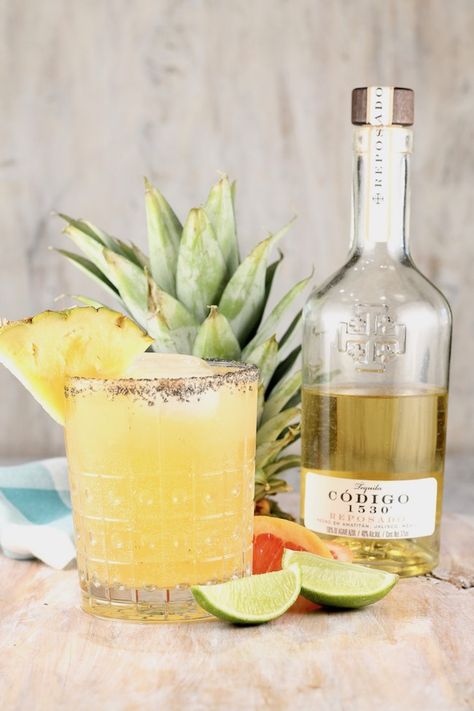 The Pineapple Paloma Cocktail is a refreshing and delicious party drink for any get together. Easy to mix up by the glass or make a pitcher for a crowd. Everyone will love this fun and easy tequila cocktail! #pineapplecocktail #tequila #codigo1530 via @missnthekitchen Peach Paloma Cocktail, Tequila Reposado Cocktails, Pineapple Paloma, Tequila Sunrise Cocktail, Paloma Cocktail, Pineapple Margarita, Booze Cruise, Pineapple Cocktail, Tequila Cocktail