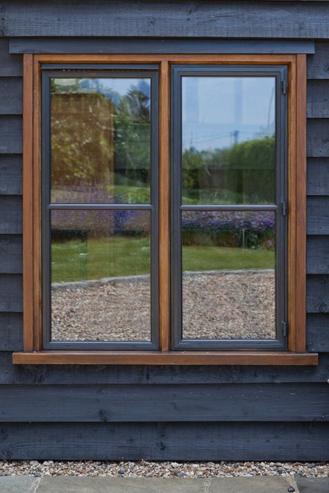 Dark wood cladding and bronze windows are a fabulous combination. #bronze windows#metal windows#bespoke windows#wood cladding and windows