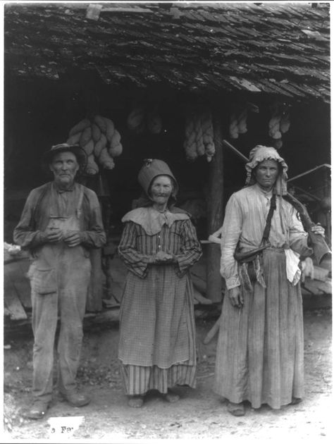 Title: The Faust family, Anderson County, E. Tenn. [Mountain man and 2 women in front of house] Date Created/Published: c1910. Appalachian People, Appalachian Mountains, East Tennessee, Mountain Man, Antique Photos, Old West, Vintage Pictures, Vintage Photographs, Historical Photos